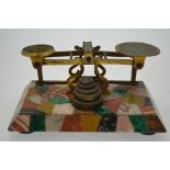 An unusual set of Victorian brass postage scales on specimen marble base,