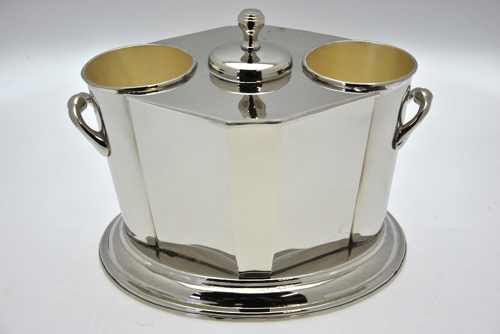 An electroplated two-bottle wine cooler with ice compartment