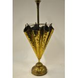 A brass umbrella stand in the form of a part open umbrella circa 1920's