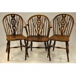 A set of five 19th century elm seat star fret-back chairs comprising a single elbow chair and four