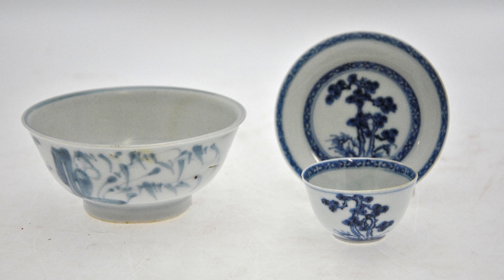 A Chinese blue and white Nanking Cargo teabowl and saucer decorated with a watery landscape to/w a