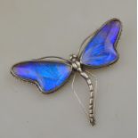 A silver set dragonfly brooch set with blue/purple butterfly wings stamped silver, wingspan approx 8