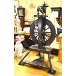 A 19th century cottage spinning wheel with turned spindle wheel,