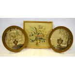 A pair of Georgian silk long-stitch oval panels, worked with urns, 33 x 29 cm,
