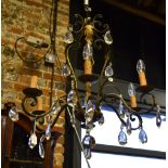 A vintage gilt patinated French six-branch crystal hung electrolier