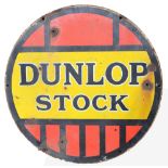 A vintage circular enamelled advertising sign 'Dunlop Stock',