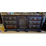 An 18th century George III estate oak and pollard oak low dresser, the wide two plank top over a