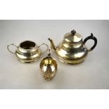 An Edwardian silver teapot and matching sugar basin of compressed pear-shape form, A & J Zimmerman,