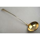 An 18th century OEP silver soup ladle with slender stem, maker's mark rubbed,