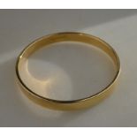 A 9ct yellow gold bangle approx 1 cm wide, approx 45g in bracelet box, 6.9 cm Condition Report