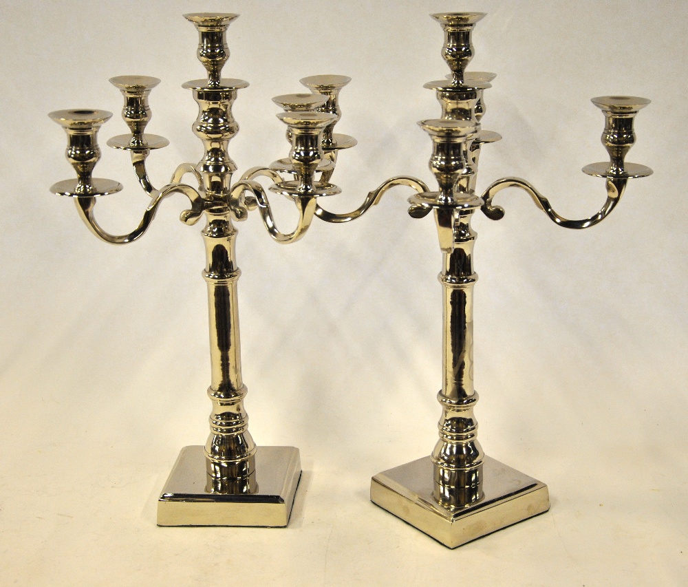 A large pair of electroplated four-branch candelabra,