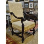 A pair of 19th century carved walnut framed open armchairs with upholstered backs and seats,