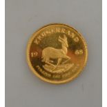 A gold Krugerand coin,