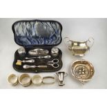 A cased silver manicure set, including toothbrush, Chester 1913 (replacement nail-scissors),