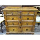 A 17th/18th century oak chest of four long graduated drawers with applied mouldings,