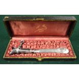 A French ham-bone holder with embossed and chased .800 grade handle, in fitted case from H.