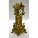 A brass miniature longcase clock with 8-day drum movement, the trunk incorporating a thermometer,
