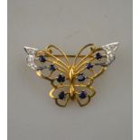 An open work style butterfly brooch,