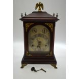 A late 19th/20th century walnut cased bracket clock with three train 8-day movement striking on