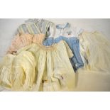 Over thirty items of Victorian and later children's clothing to include; party frocks,