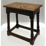 An antique oak joint stool with all-round moulded edge to the single piece top,