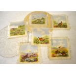 A box of table linen to include a hand-painted set of table mats,