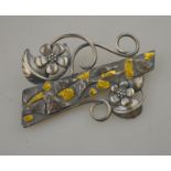 A Carol Darby contemporary style silver brooch with gilded highlights,