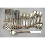 Cartier:- A part set of Sterling flatware and cutlery in the Wallace 'Grand Baroque' pattern,