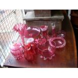 Collection of 13 pieces of cranberry glass.