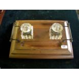 Victorian mahogany inkstand; two square-cut glass bottles; tray handles.