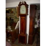 Regency mahogany satinwood-inlaid longcase clock with painted arch dial and eight-day movement.