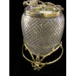 Silver-plated and crystal glass biscuit barrel on silver-plated rustic squirrel stand.