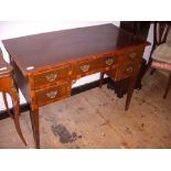 Edwardian mahogany inlaid kneehole five-drawer side table, tapered supports.