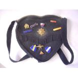 Heart-shaped felt ‘Girl Guide’ bag with badges.