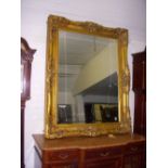 Large gilt swept-frame mirror, 4ft x 5ft.