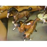 Three Beswick horses.