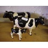 Beswick Frisian bull, cow and calf , gloss. (3).