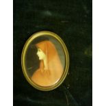 Portrait miniature of a lady in a red veil. Oval, bears signature. 3¾ins x 3ins