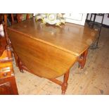 Victorian mahogany dropleaf dining table with turned supports.