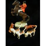 Beswick ‘Rearing Huntsman on Bay Horse’ (868) with two foxes and three hounds.