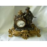 19th Century French chiming timepiece ornamented by a bronzed metal figurine.