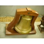 George VI brass fire engine bell on mahogany stand.