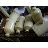 Collection of seven stoneware hot water bottles.