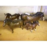 Four Beswick ponies.