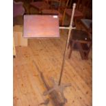 Adjustable Victorian music stand, cast iron and brass with mahogany shelf.