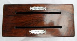 A Victorian rosewood stationery box of rectangular form with two slots with engraved mother of pearl