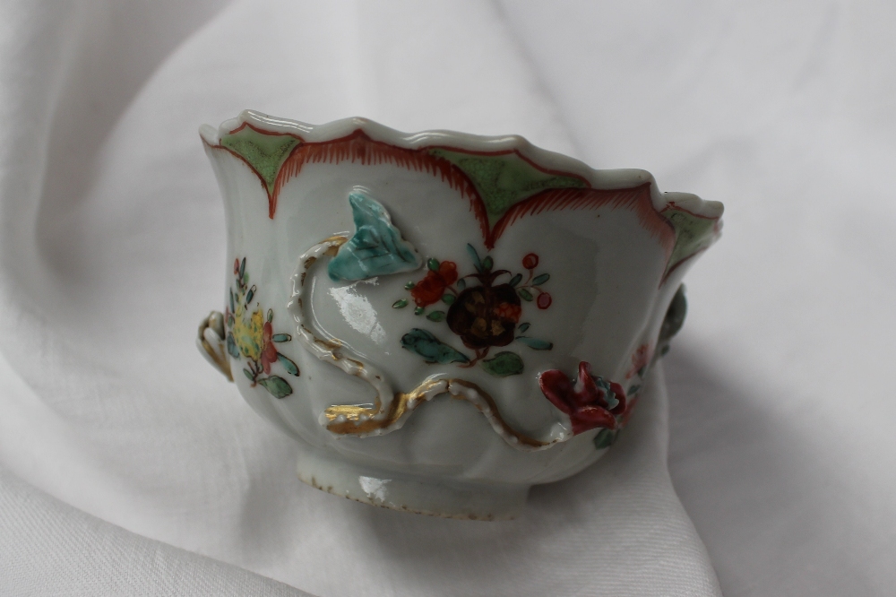 A 19th century Chinese porcelain bowl with a scalloped edge with ogee panels, sprays of garden - Image 2 of 6