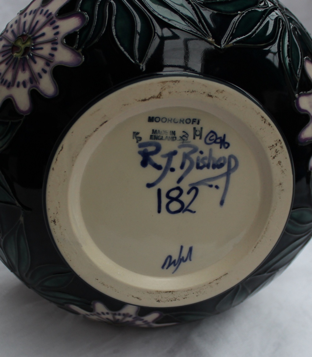 A modern Moorcroft carousel pattern vase with a tapering neck and squat body, impressed mark, signed - Image 3 of 3