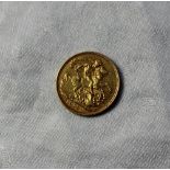 An Edward VII gold sovereign dated 1903,