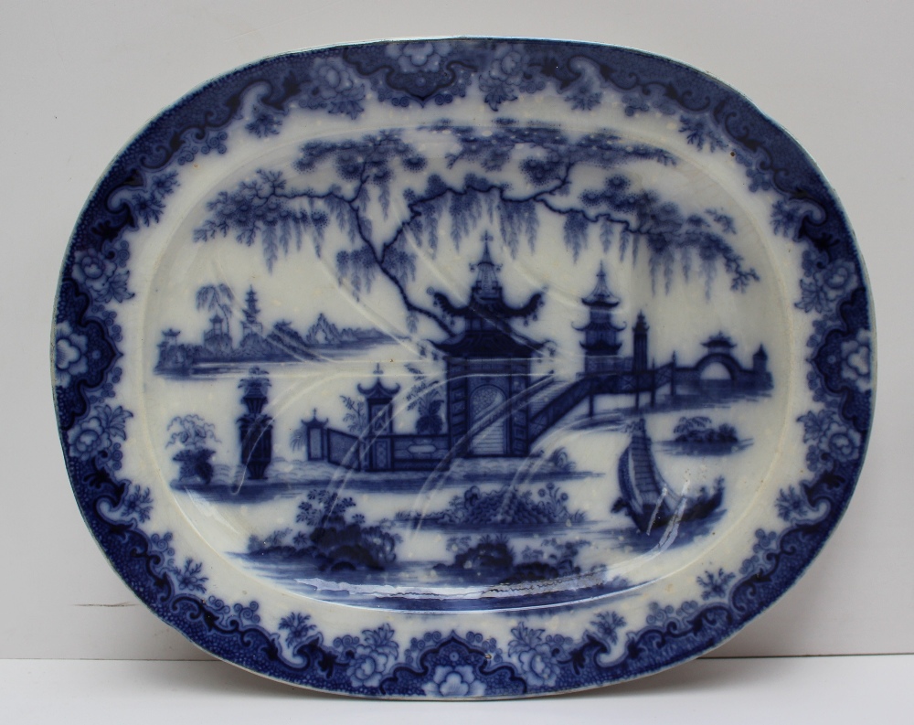 A Dillwyn pottery meat plate decorated in the Whampoa pattern, with gravy tree and well, printed
